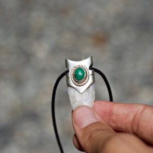 details of a malachite jewel necklace lined in silver