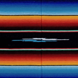 Black Mexican blanket with colourful blue and orange stripes and a symbol in the centre